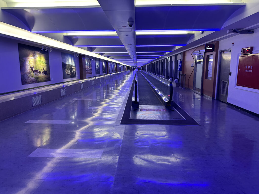 a long hallway with a blue light