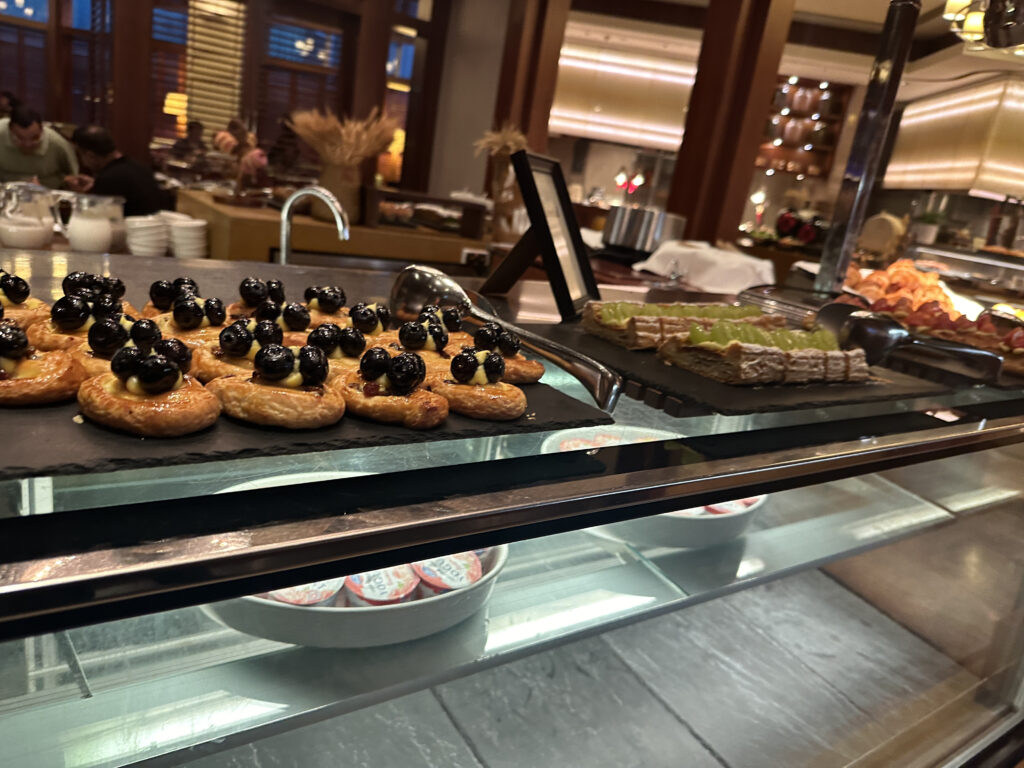 a display case with pastries and desserts
