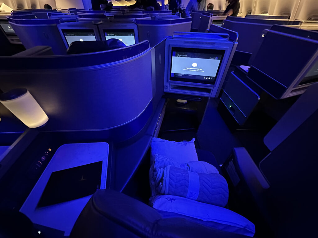 a room with rows of seats and a computer