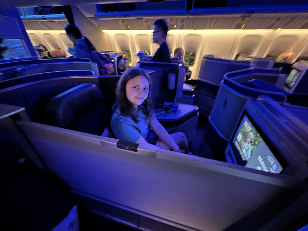 a girl sitting in an airplane
