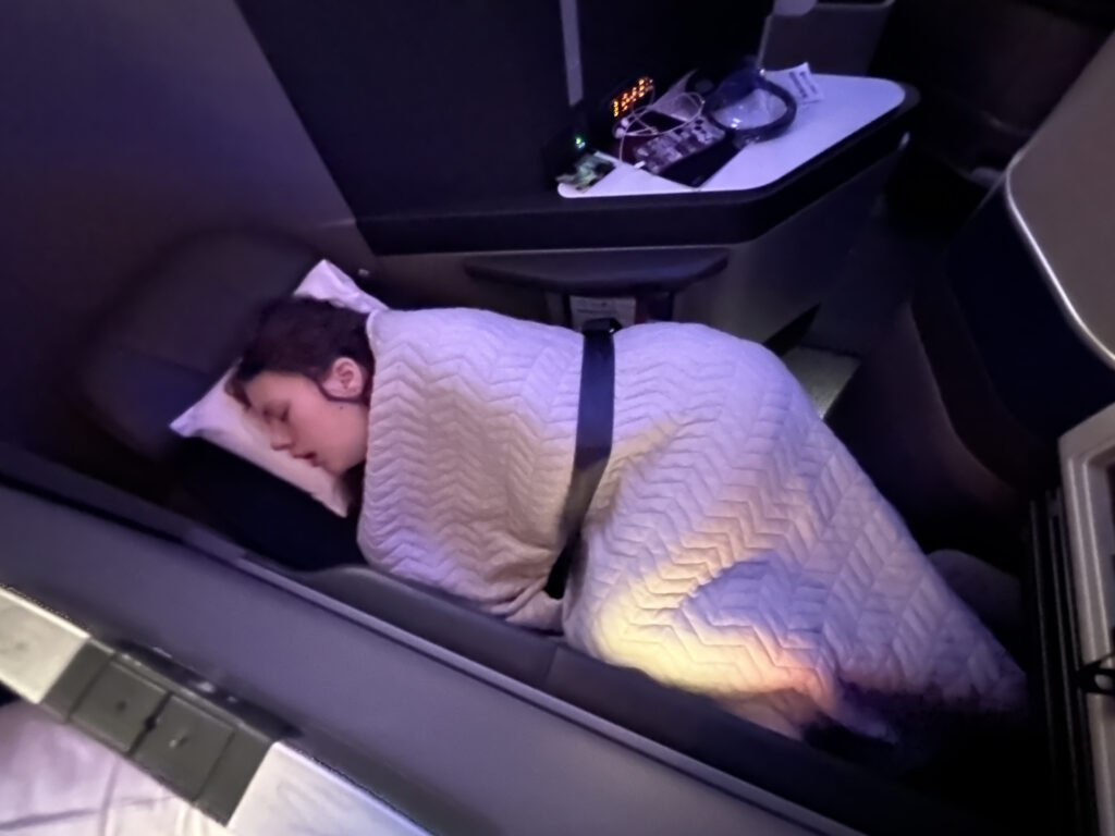 a woman sleeping on a bed