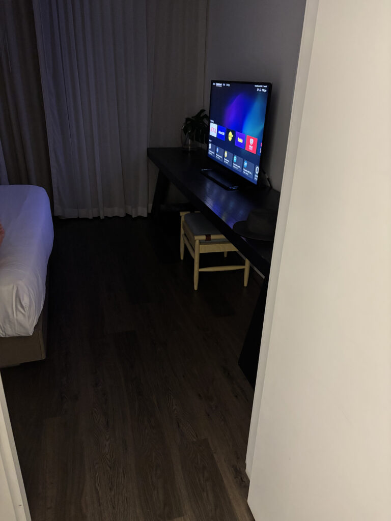a tv on a desk in a room