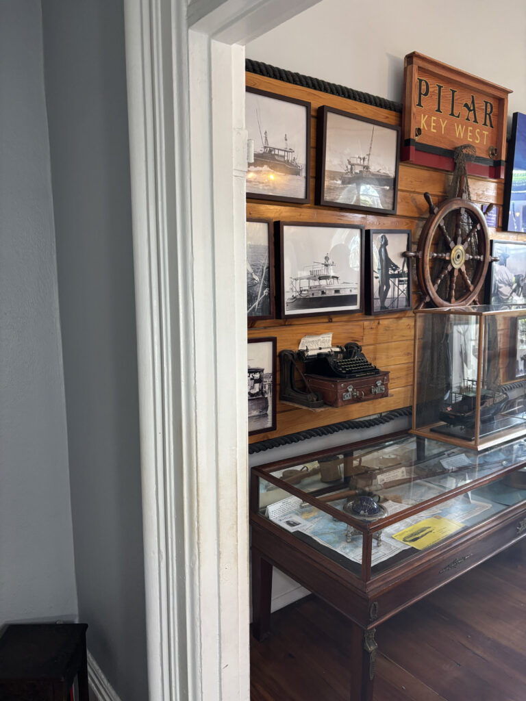 a display case with pictures and a steering wheel