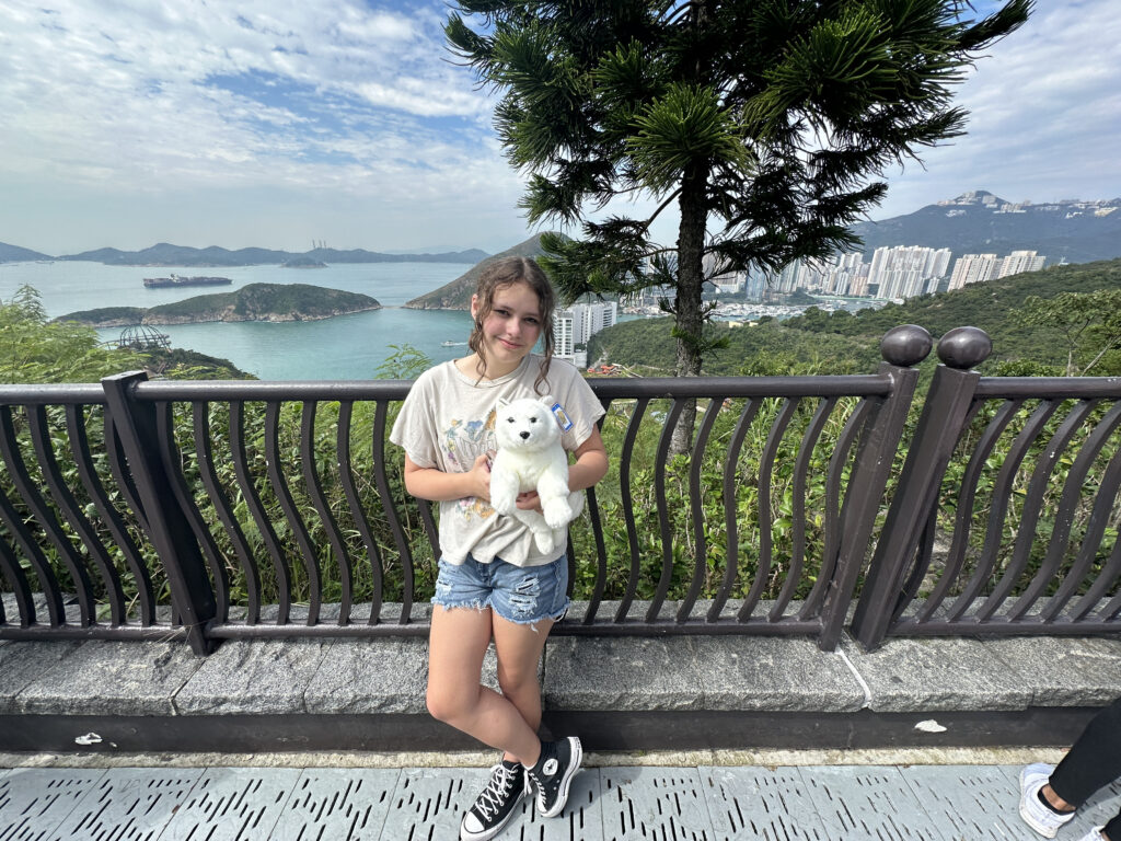 a girl holding a stuffed animal