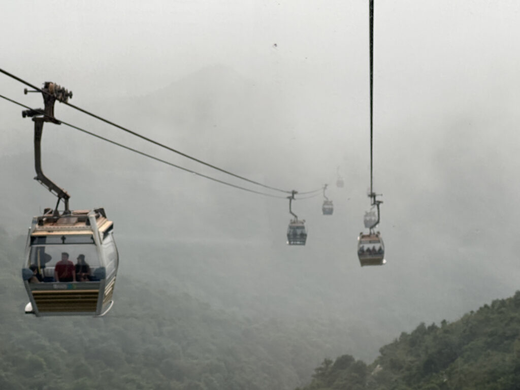 a group of people on a cable car