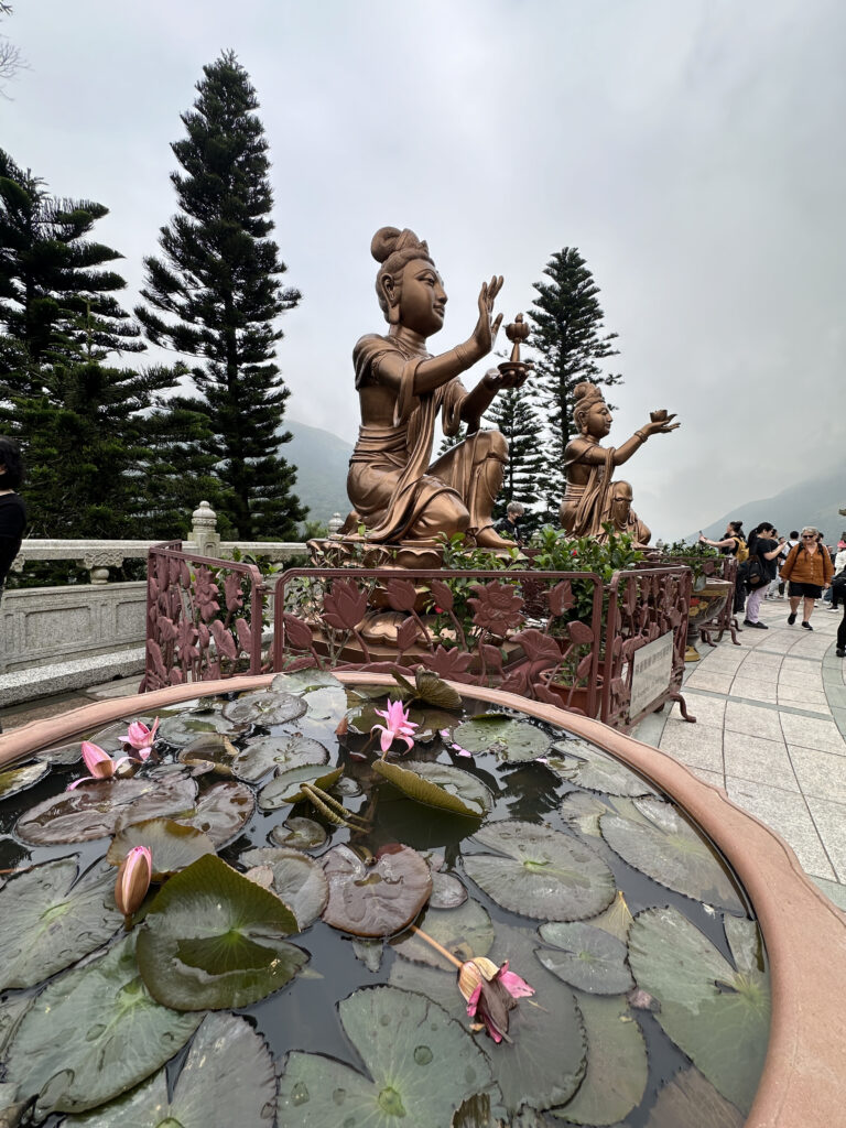 a statue of a woman holding her hands up