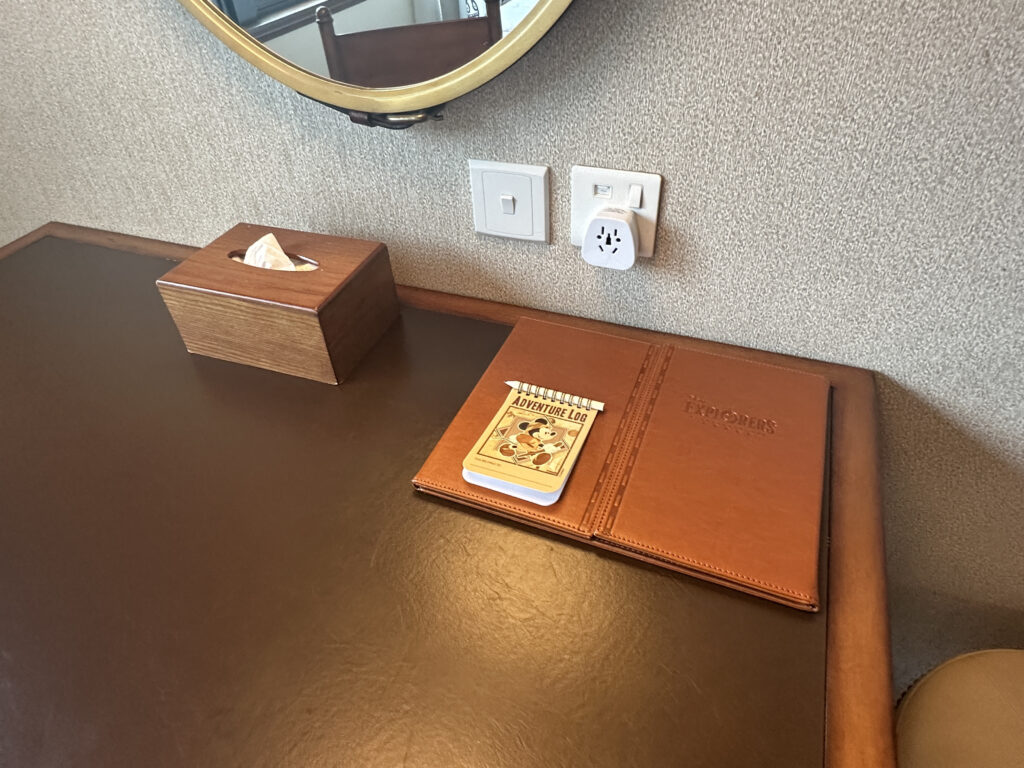 a table with a book and tissue box on it