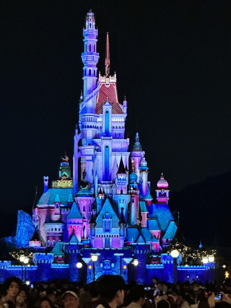 a castle lit up at night