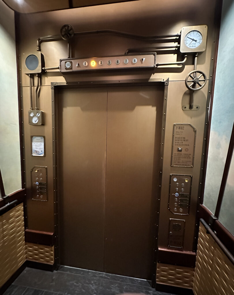 a elevator with a clock and gauges