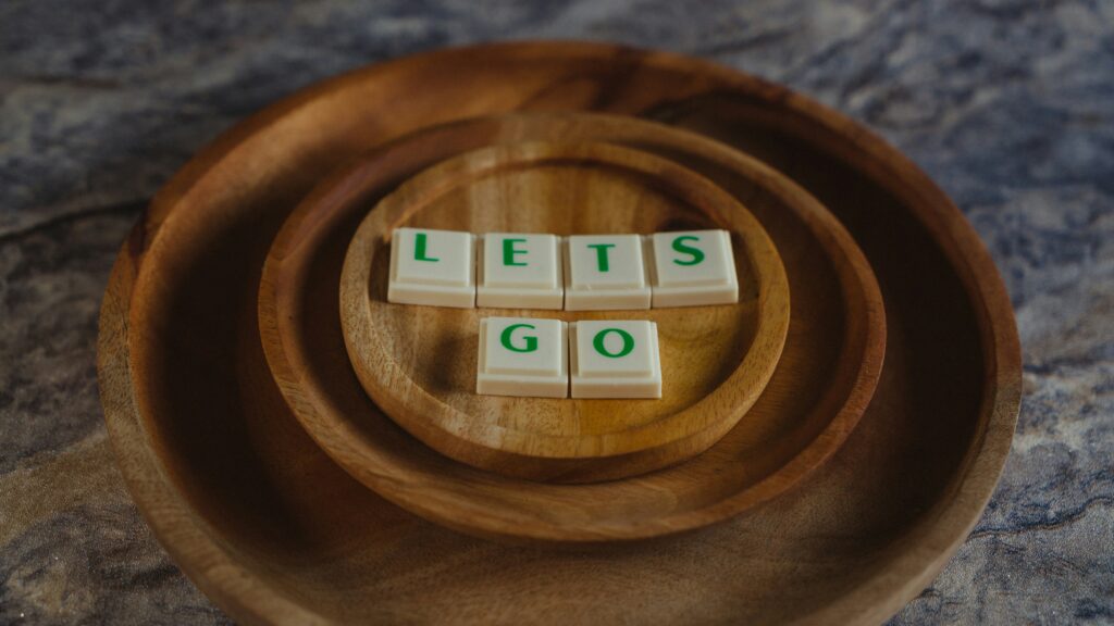 a wooden plate with letters on it