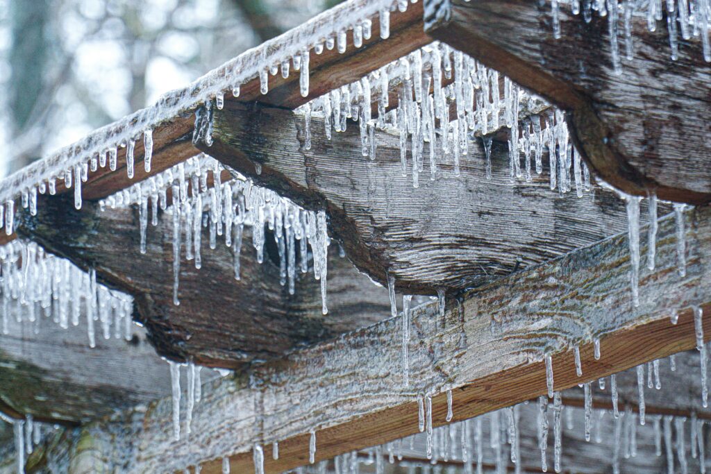 icicles from a wooden beam