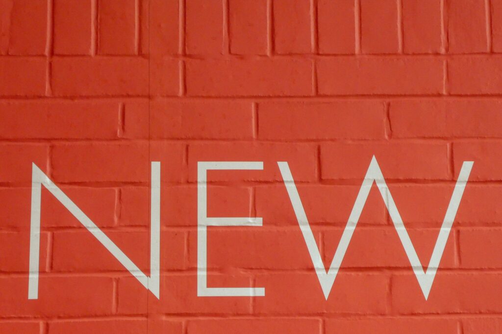 a brick wall with white text