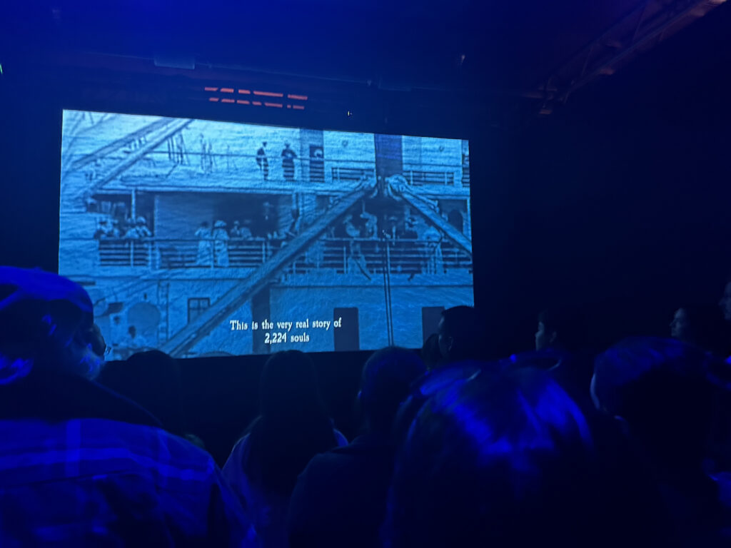 a large screen with a picture of people in the background