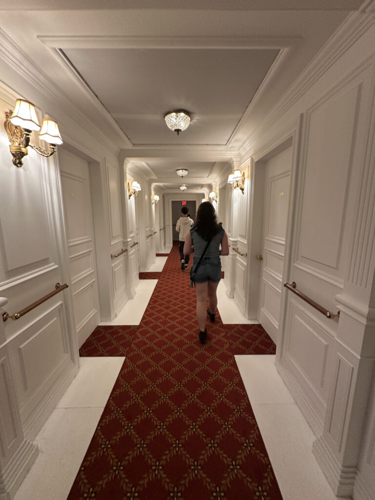 a woman walking down a hallway