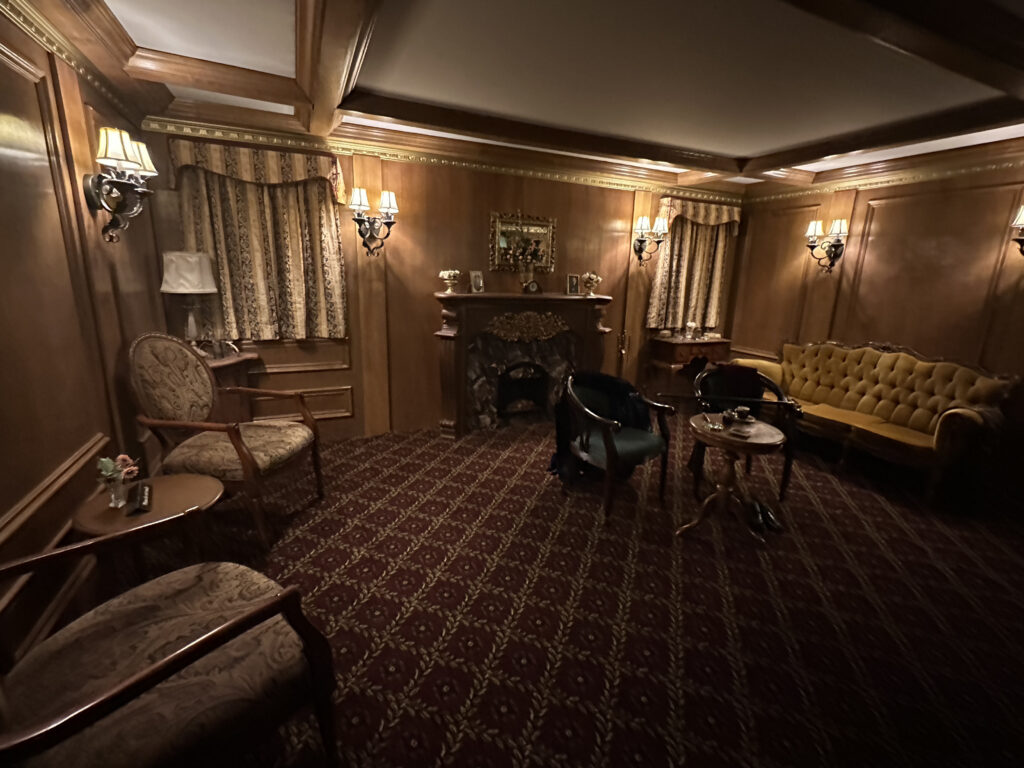 a room with a fireplace and chairs
