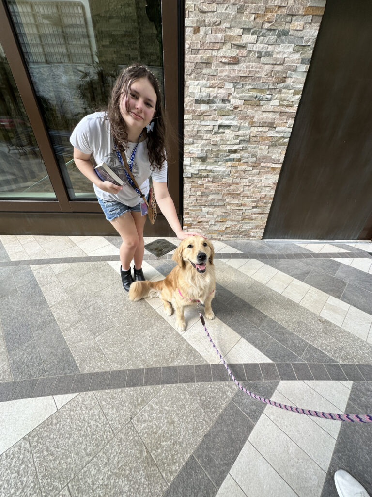 a girl with a dog on a leash