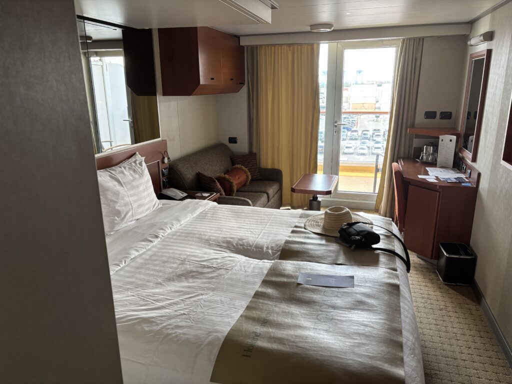 a hotel room with a bed and a chair