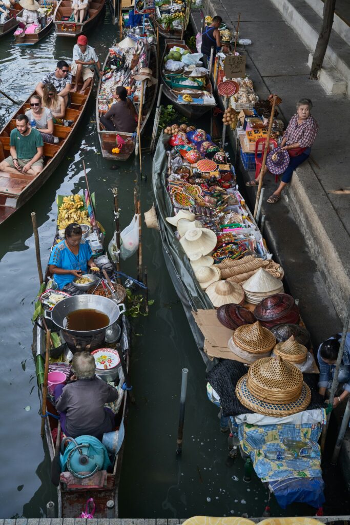 a group of people on boats in a canal