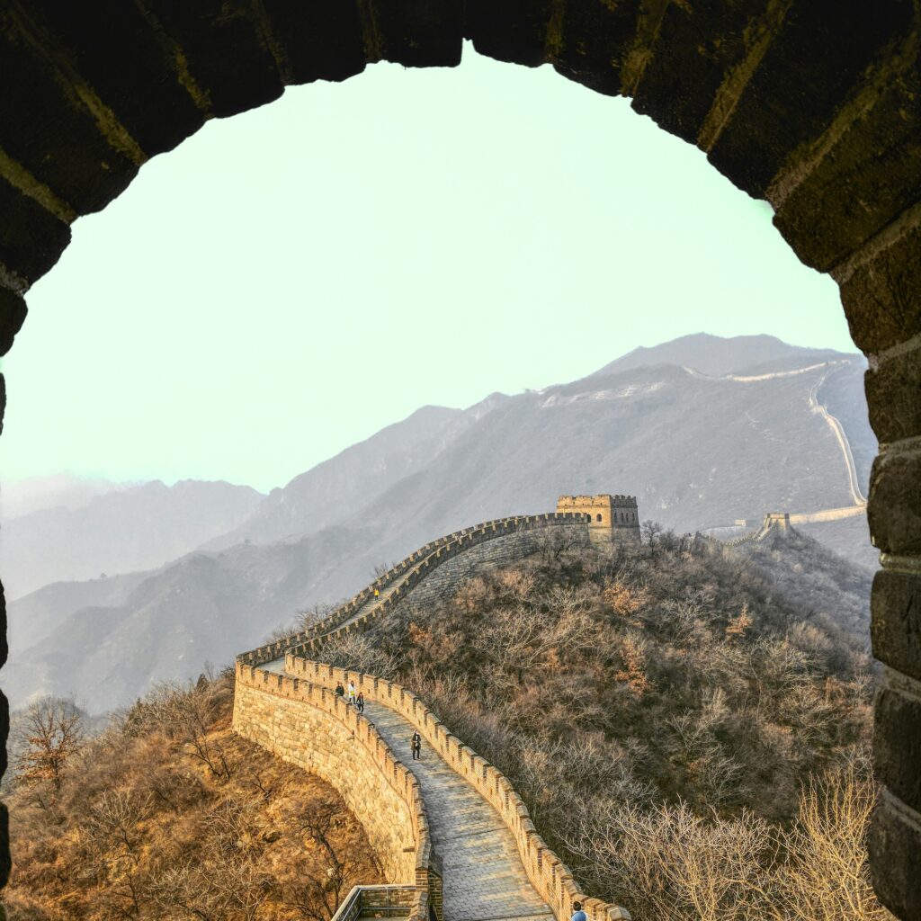 a stone archway with a wall on the side
