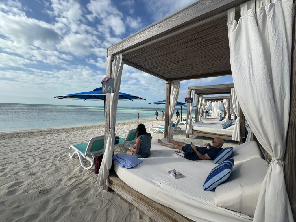 a couple of people lying on a beach