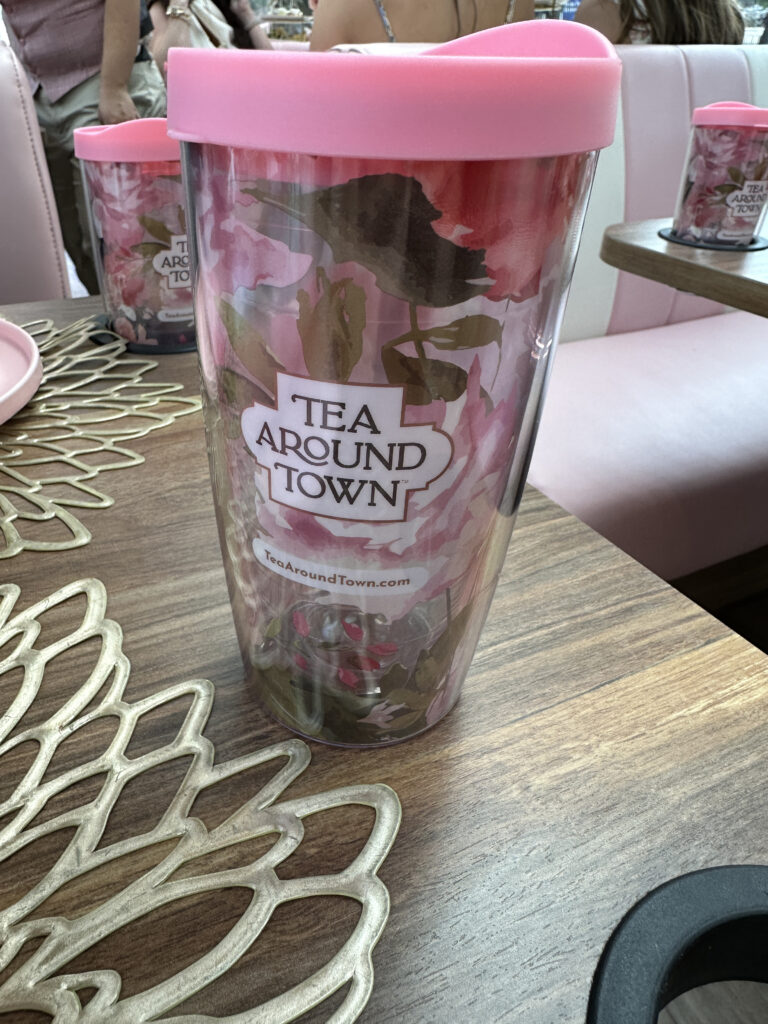 a pink and brown cup with a pink lid