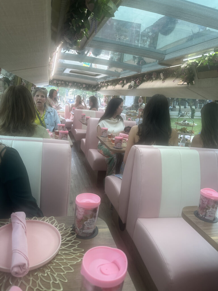 a group of women sitting at tables in a restaurant