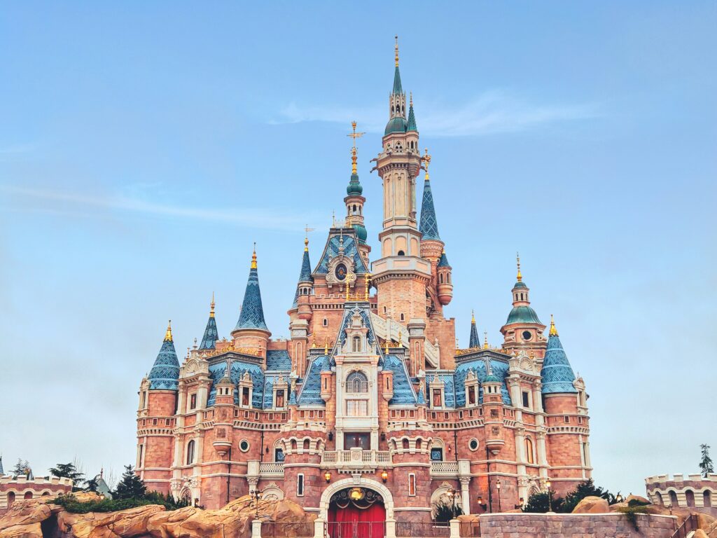 a castle with blue and pink roofs