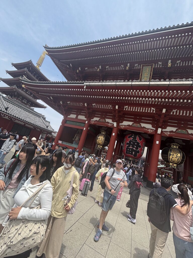 a group of people in front of a large building with Sensō-ji in the background