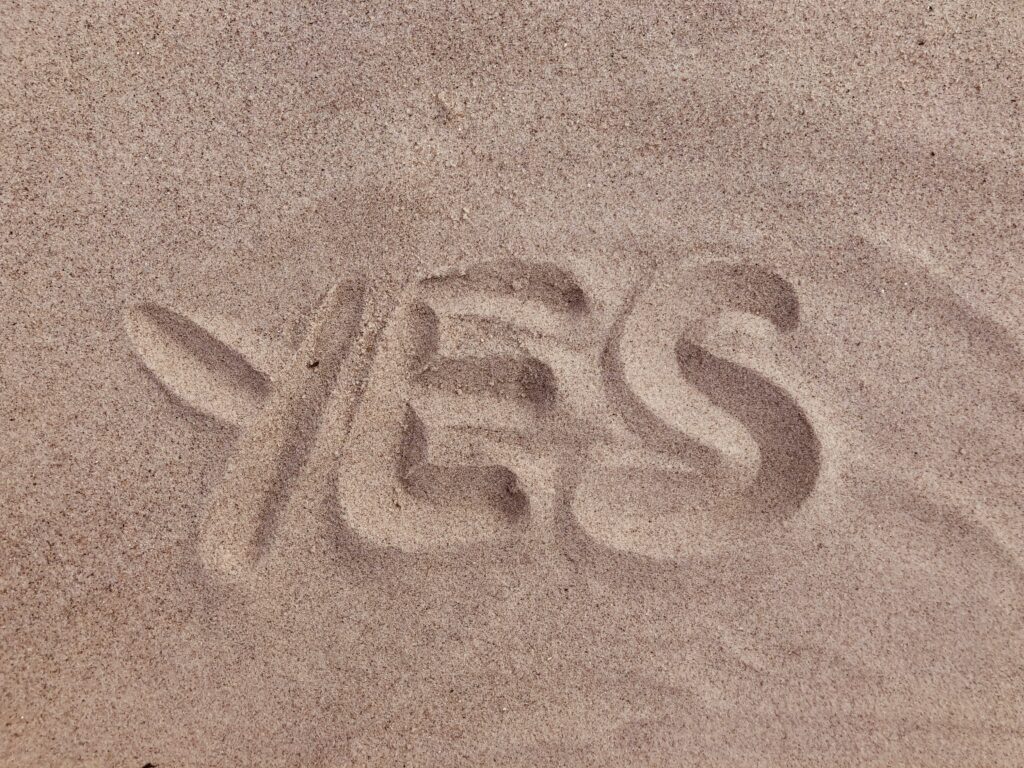a close-up of a word written in sand